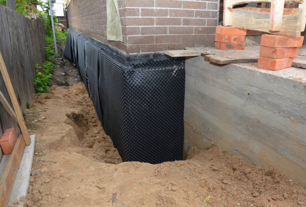 SJ Waterproofing Pros technician performing targeted Interior Drainage System assessment in Eclectic, AL